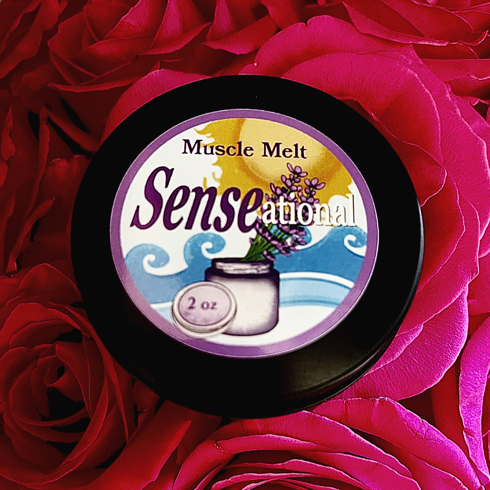 Muscle Melt salve container on rose petals.